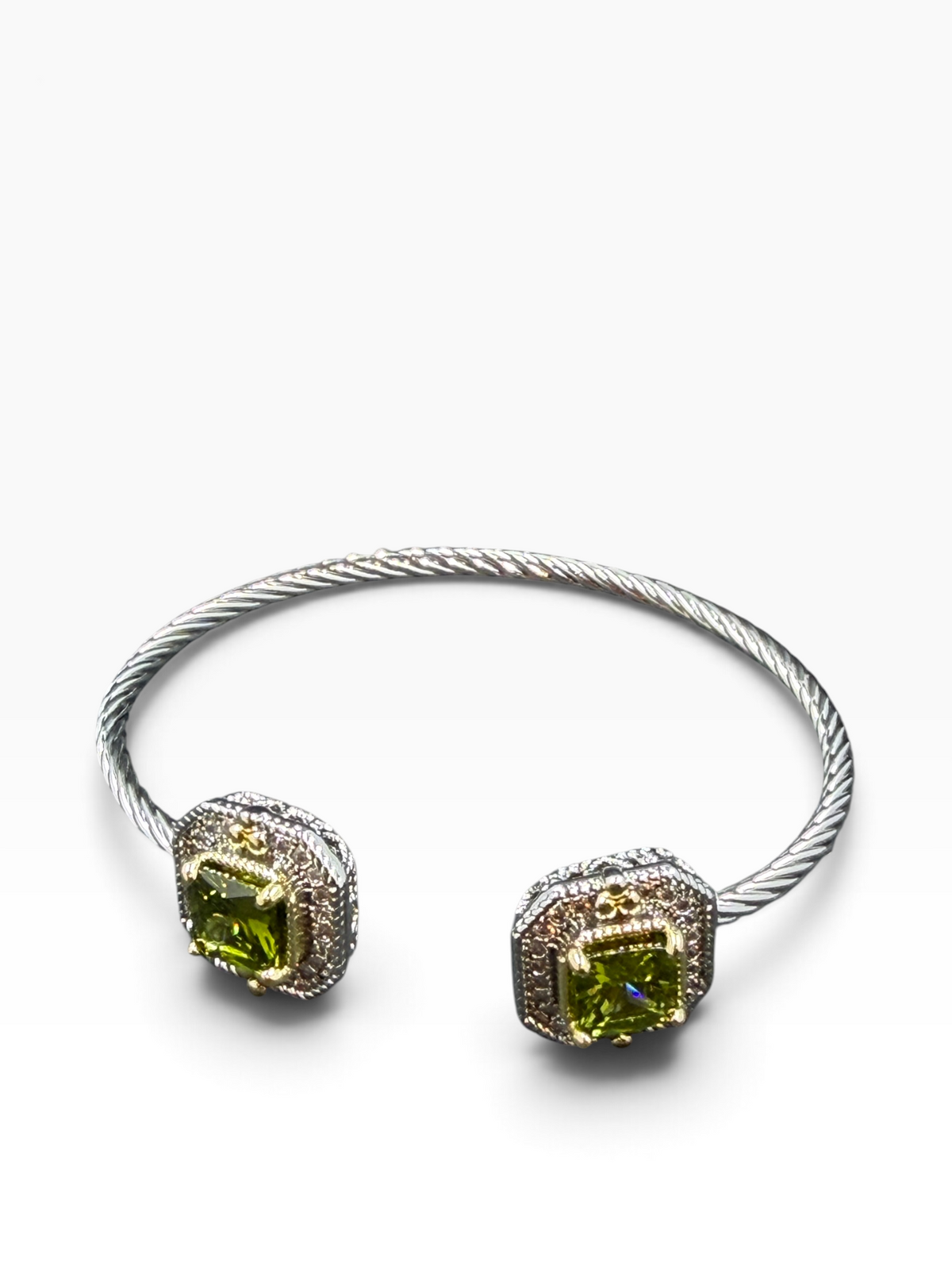 Alice stainless steel bangle with gold-tone accents and green cubic zirconia cluster ends