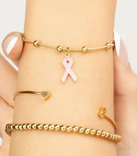 Gold adjustable bracelet with awareness ribbon charm