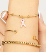 Gold adjustable bracelet with awareness ribbon charm