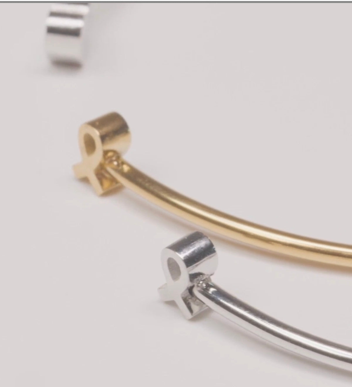 Hope bangles in silver and gold, breast cancer awareness gift