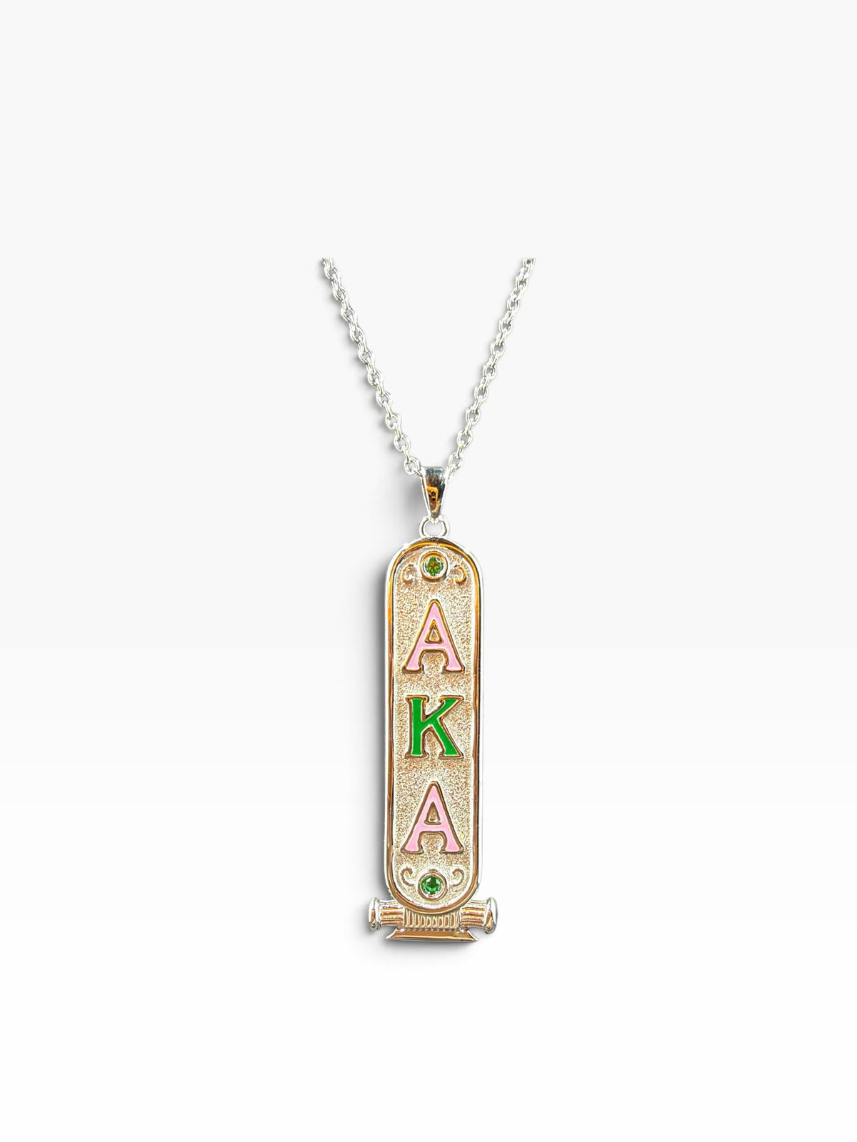 AKA sterling silver cartouche necklace, rhodium plated, with pink and green enamel Greek letters and green CZ stones