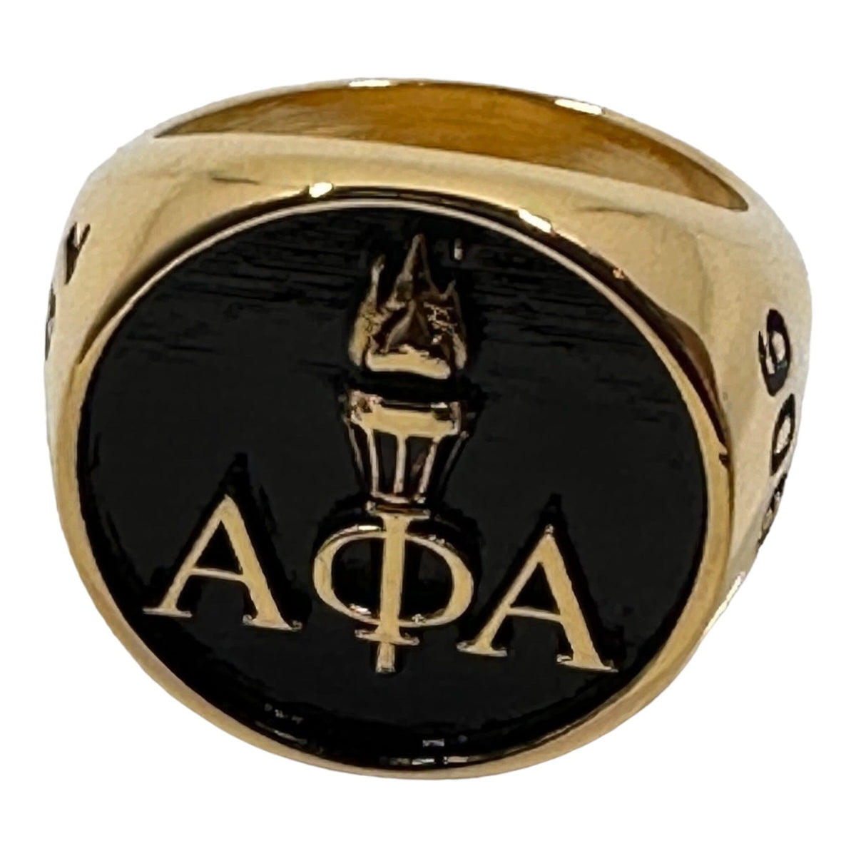 Alpha Phi Alpha Light of the World gold ring featuring 18k gold PVD plating with engraved A Phi A Greek letters and torch design.