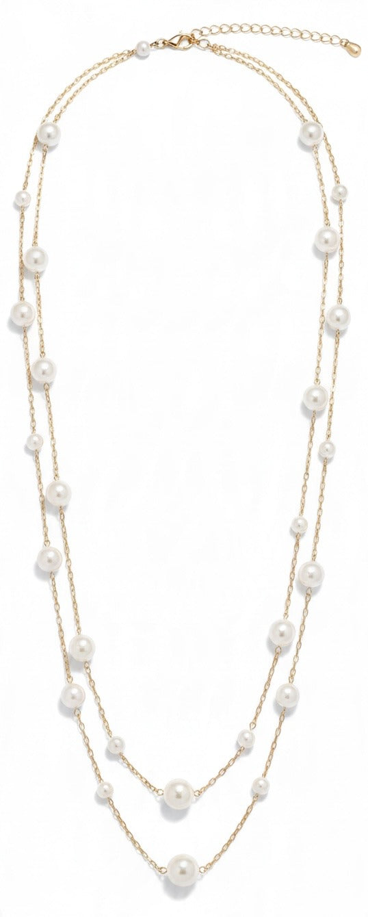 Double row glass pearl necklace in gold with white pearls in mixed sizes on two fine chains