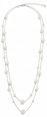 Double row glass pearl necklace in silver with white pearls in mixed sizes on two fine chains