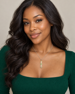 African American woman wearing the AKA sterling silver cartouche necklace in rhodium plating