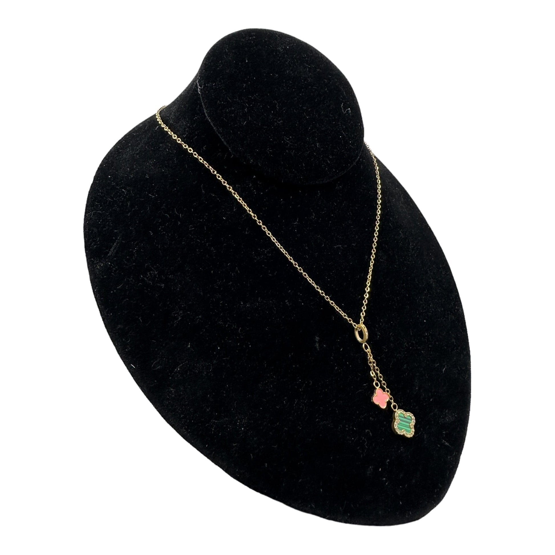 Kaitlin Double Drop Pink and Green Gold Necklace displayed on a black velvet jewelry stand, featuring green malachite and pink stones on a stainless steel chain plated in 18k gold.
