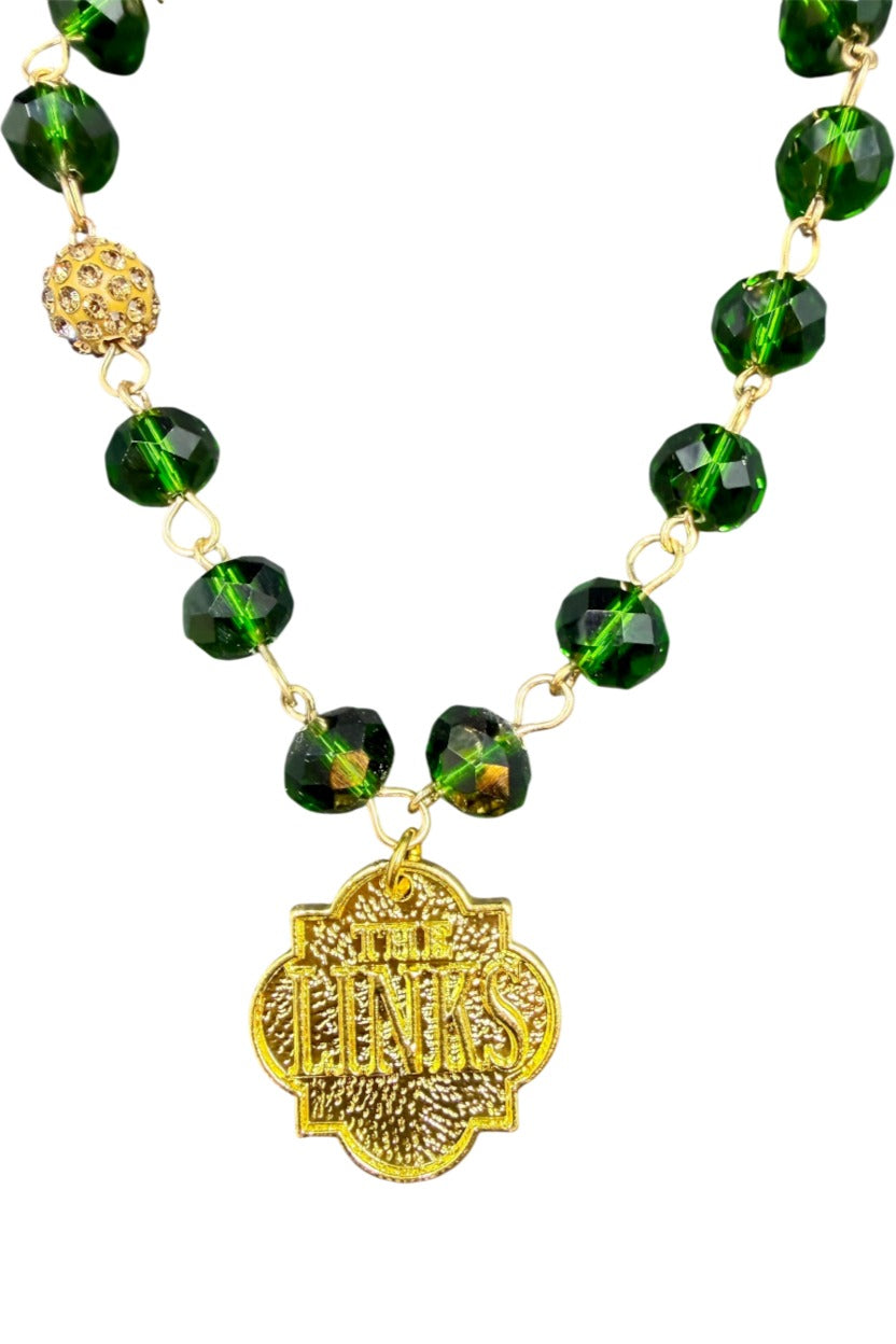 The Links, Incorporated green crystal bead bracelet in gold with gold THE LINKS charm and pavé accent bead