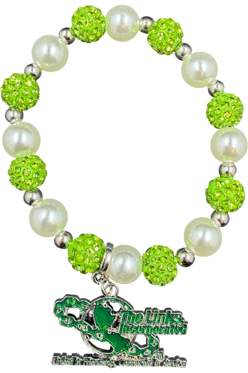 The Links, Incorporated stretch bracelet with green pavé beads, white pearl-style beads and green Links logo charm
