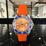 Trendzio Jewelry Blue Amber automatic watch with orange dial, blue bezel, and orange rubber strap. Inspired by Submariner design.