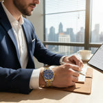 Trendzio Jewelry Blue Oro Mariner watch with gold and stainless steel bracelet, blue ceramic bezel, and sunburst blue dial.
