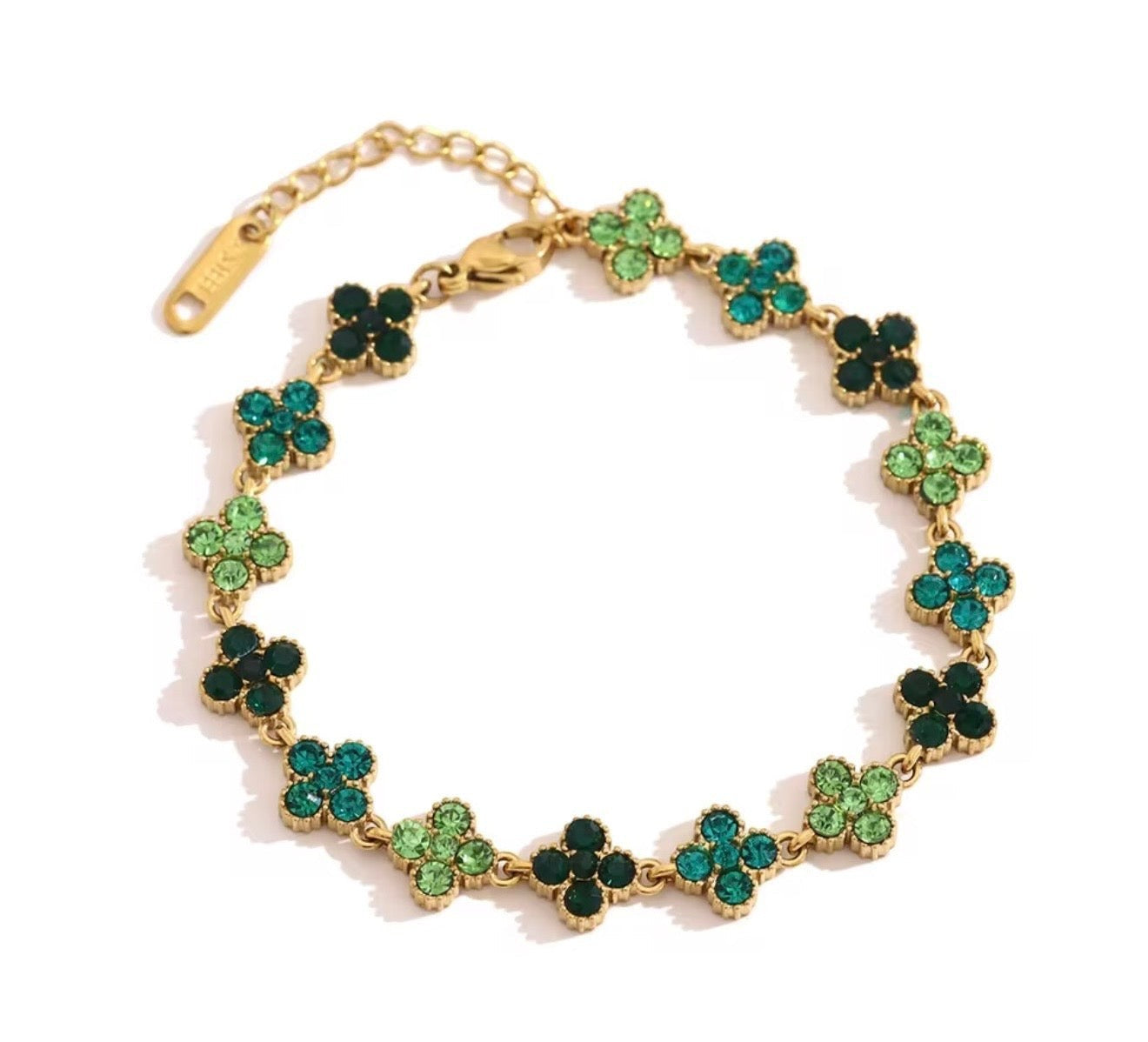 Trendzio Jewelry gold-plated stainless steel clover bracelet featuring green CZ stones in various shades.