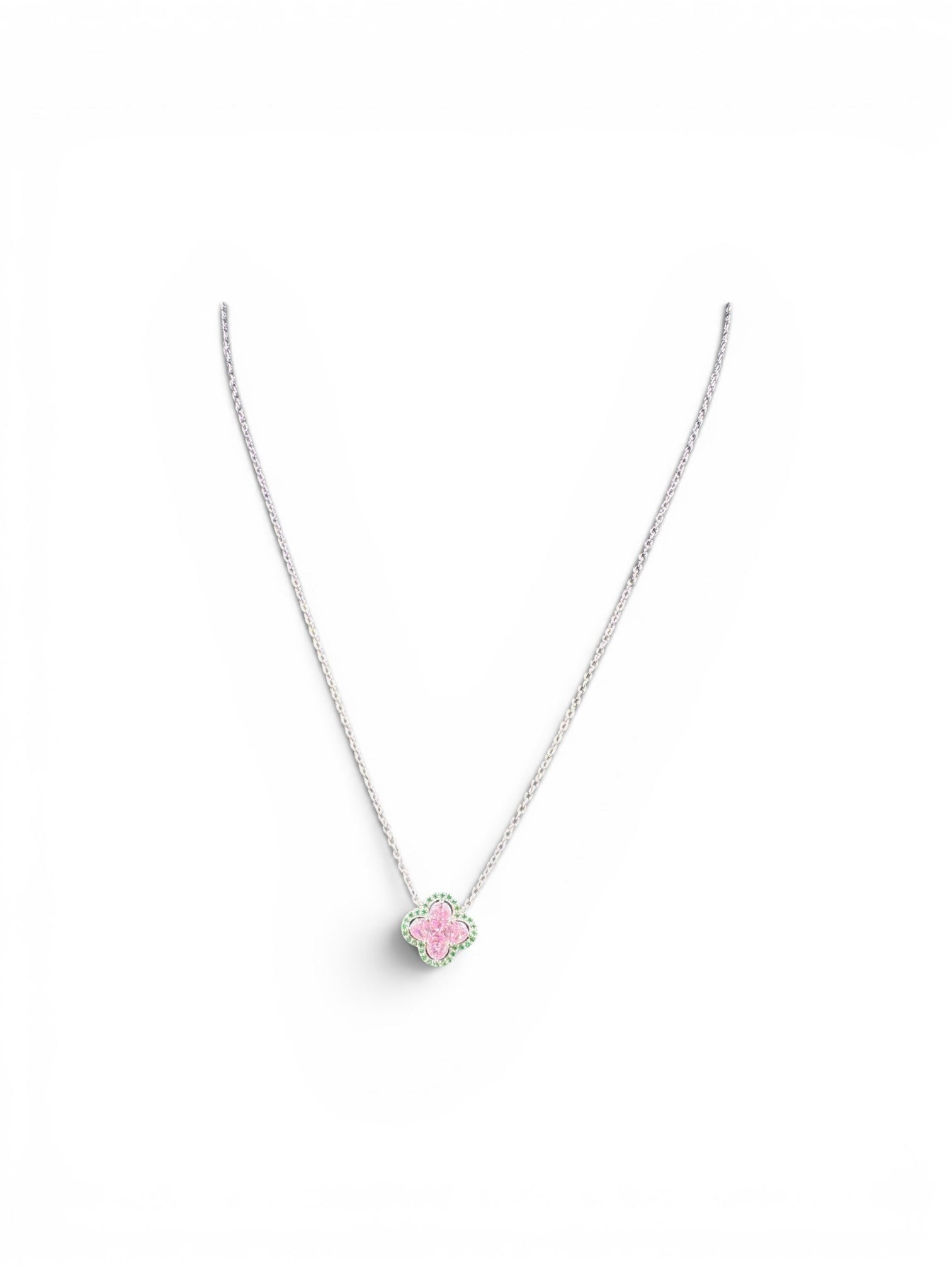 Trendzio Jewelry sterling silver clover necklace with pink and green CZ stones on a delicate chain.