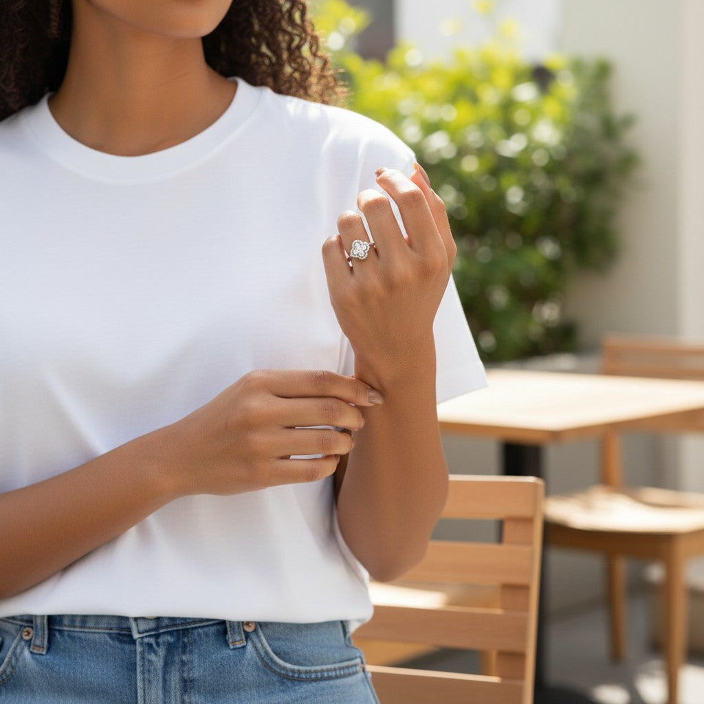 Trendzio Jewelry sterling silver clover CZ ring worn by a woman in a white t-shirt and jeans outdoors.