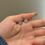 Trendzio Jewelry Ingrid clover moissanite flower stud earrings held in a hand, featuring sparkling 0.68ct stones.