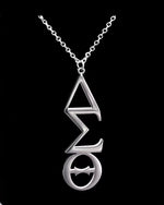 Trendzio Jewelry Delta Sigma Theta vertical Greek letter pendant in polished stainless steel on a 20-inch chain.