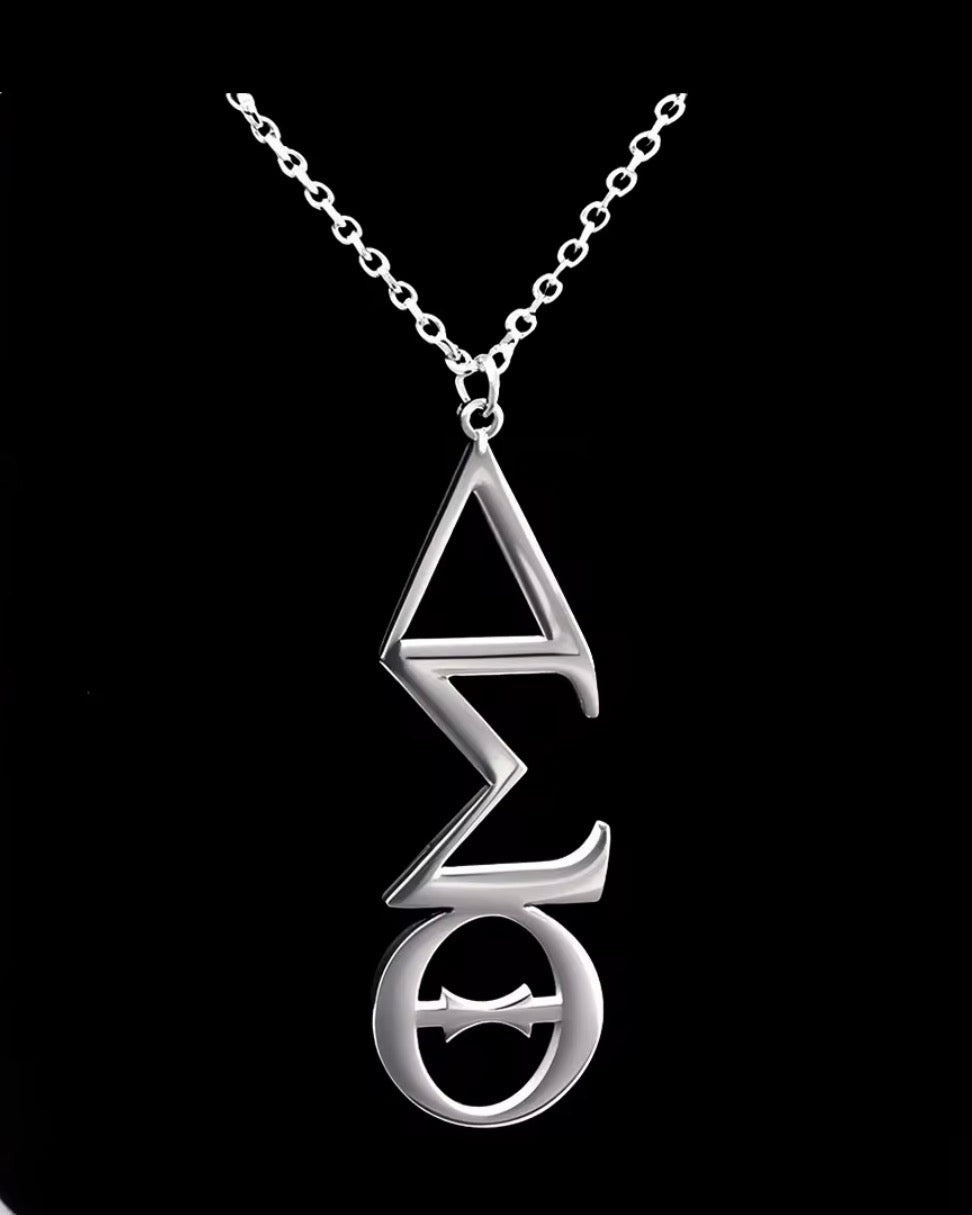 Trendzio Jewelry Delta Sigma Theta vertical Greek letter pendant in polished stainless steel on a 20-inch chain.