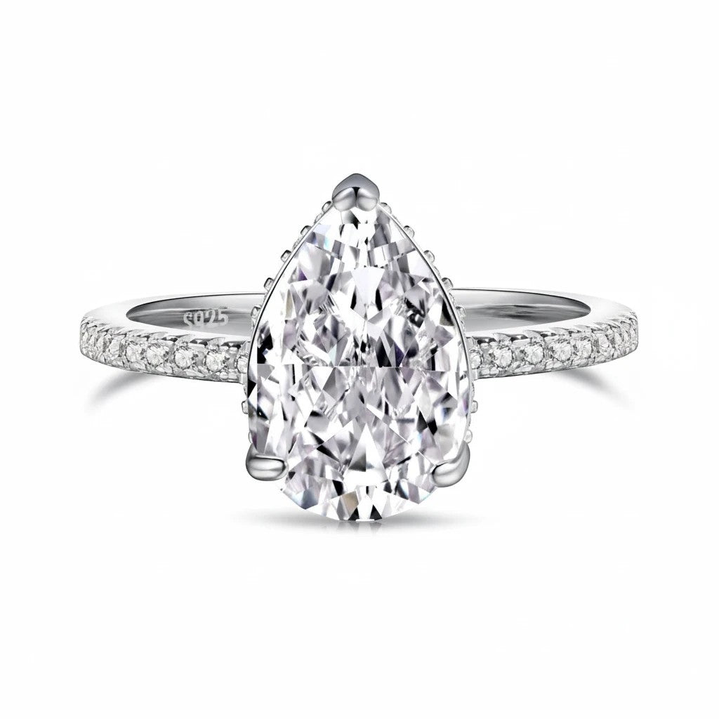 Trendzio Jewelry Lolo sterling silver ring with a pear-cut CZ diamond and pavé band on a white background.
