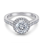 Trendzio Jewelry Lyra sterling silver ring with a round-cut CZ center stone and a shimmering pavé halo setting.