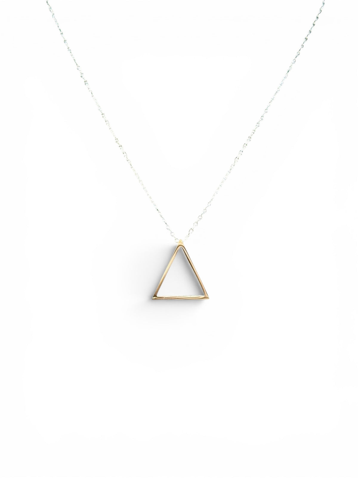 Trendzio Jewelry minimalist open triangle pendant necklace in gold on a delicate chain.