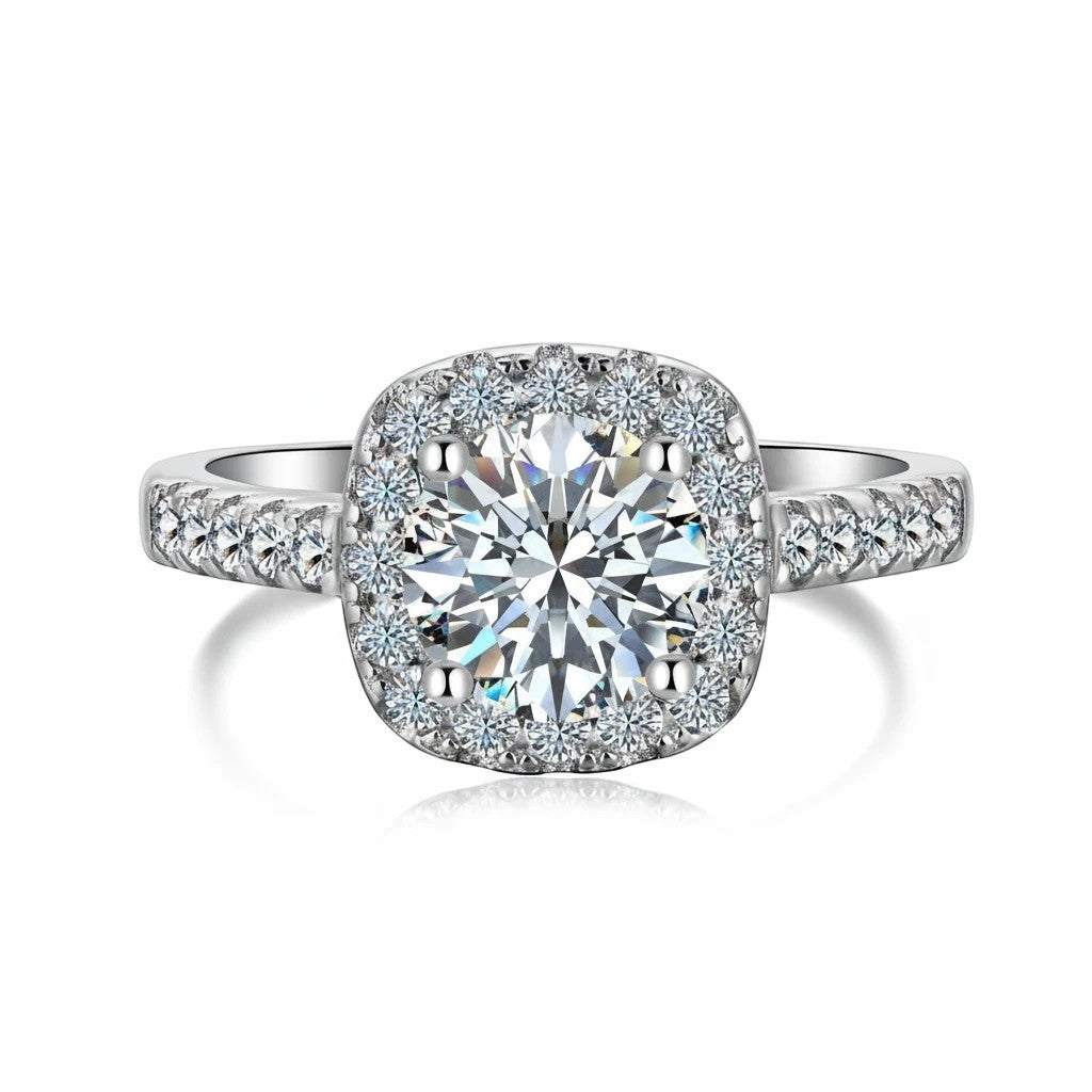 Trendzio Jewelry Mira moissanite ring with a round center stone, halo setting, and pavé silver-tone band.