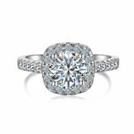 Trendzio Jewelry Mira moissanite ring with a round center stone, halo setting, and pavé silver-tone band.