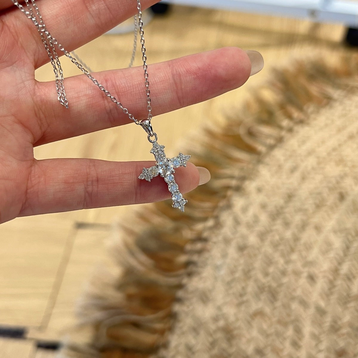 Trendzio Jewelry sterling silver cross necklace featuring sparkling moissanite stones on a delicate chain.