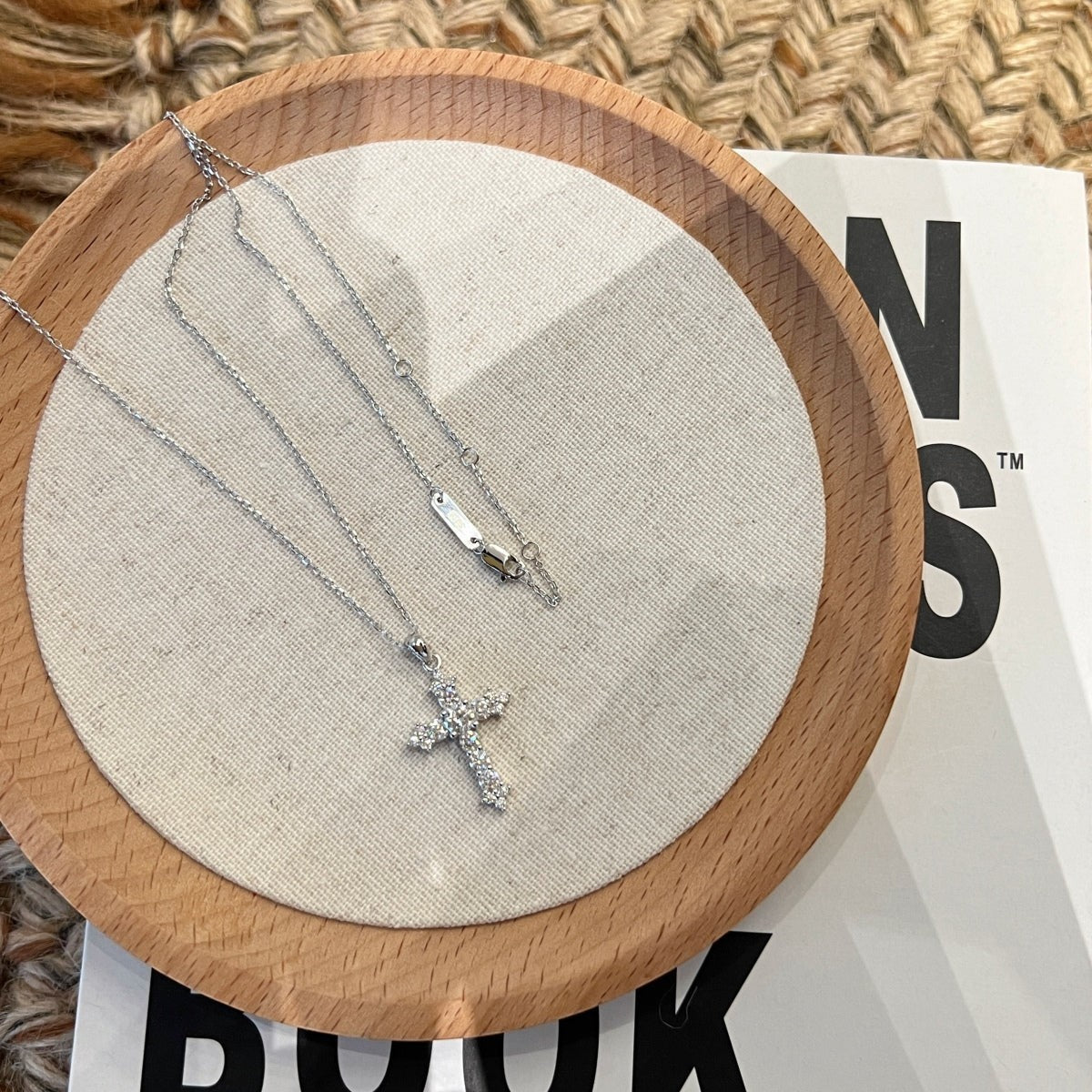 Trendzio Jewelry sterling silver cross necklace featuring sparkling moissanite diamonds on a delicate chain.