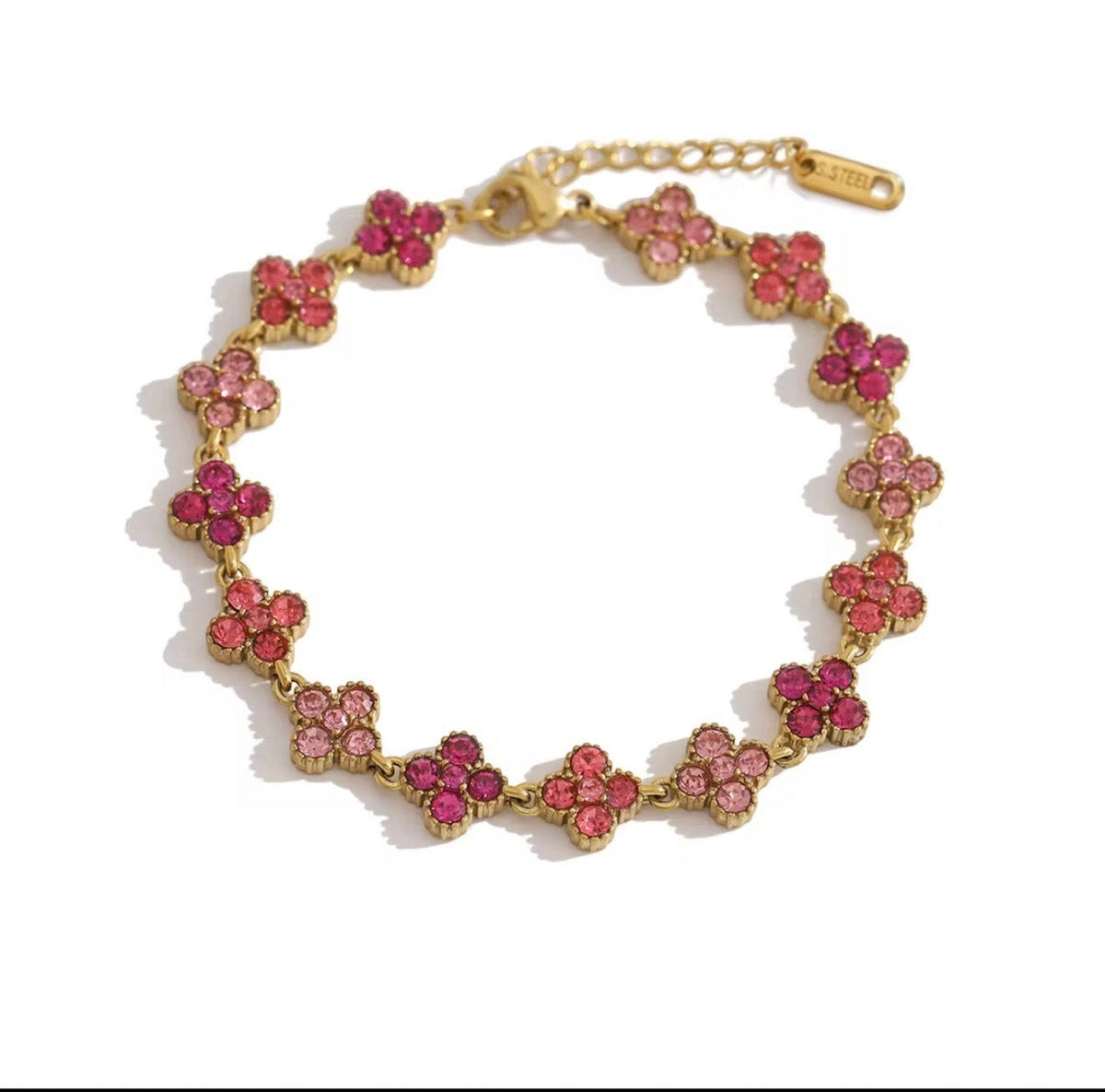 Trendzio Jewelry gold-plated stainless steel clover bracelet featuring pink CZ stones in a waterproof design.