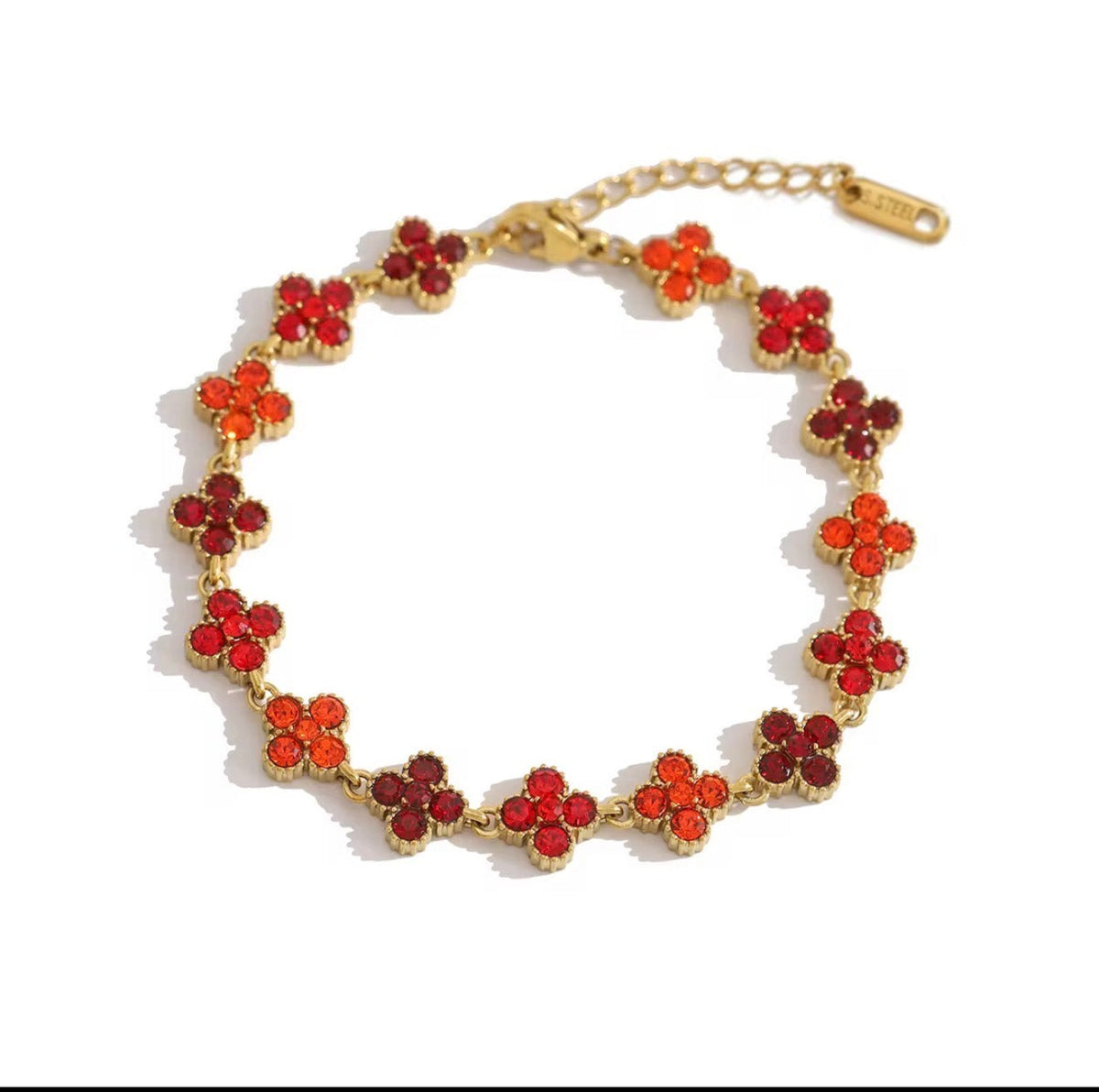 Trendzio Jewelry gold-plated stainless steel clover bracelet featuring vibrant red CZ stones in a delicate chain.