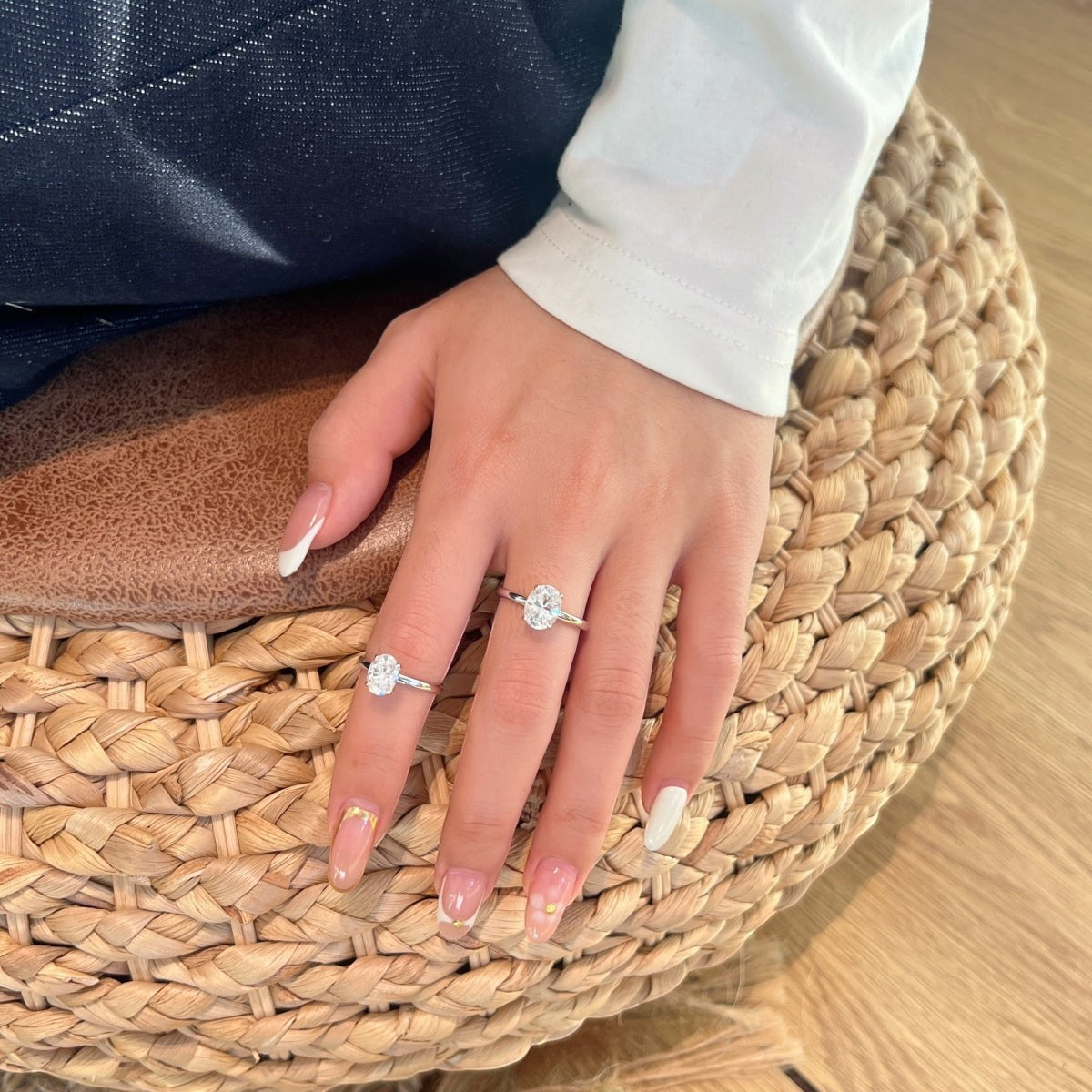 Trendzio Jewelry Sloane moissanite sterling silver rings worn on fingers with elegant French tip manicure