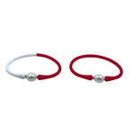Elegant pearl-accented hair ties in red and white, perfect for adding a chic touch to any hairstyle. Trendy and durable for all-day wear. 