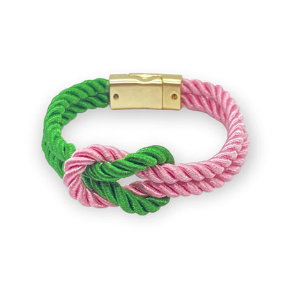 Customizable The Original Love Knot Satin Rope Bracelet with intertwined pink and green satin cords and secure magnetic clasp, showcasing university, sports, or country pride.